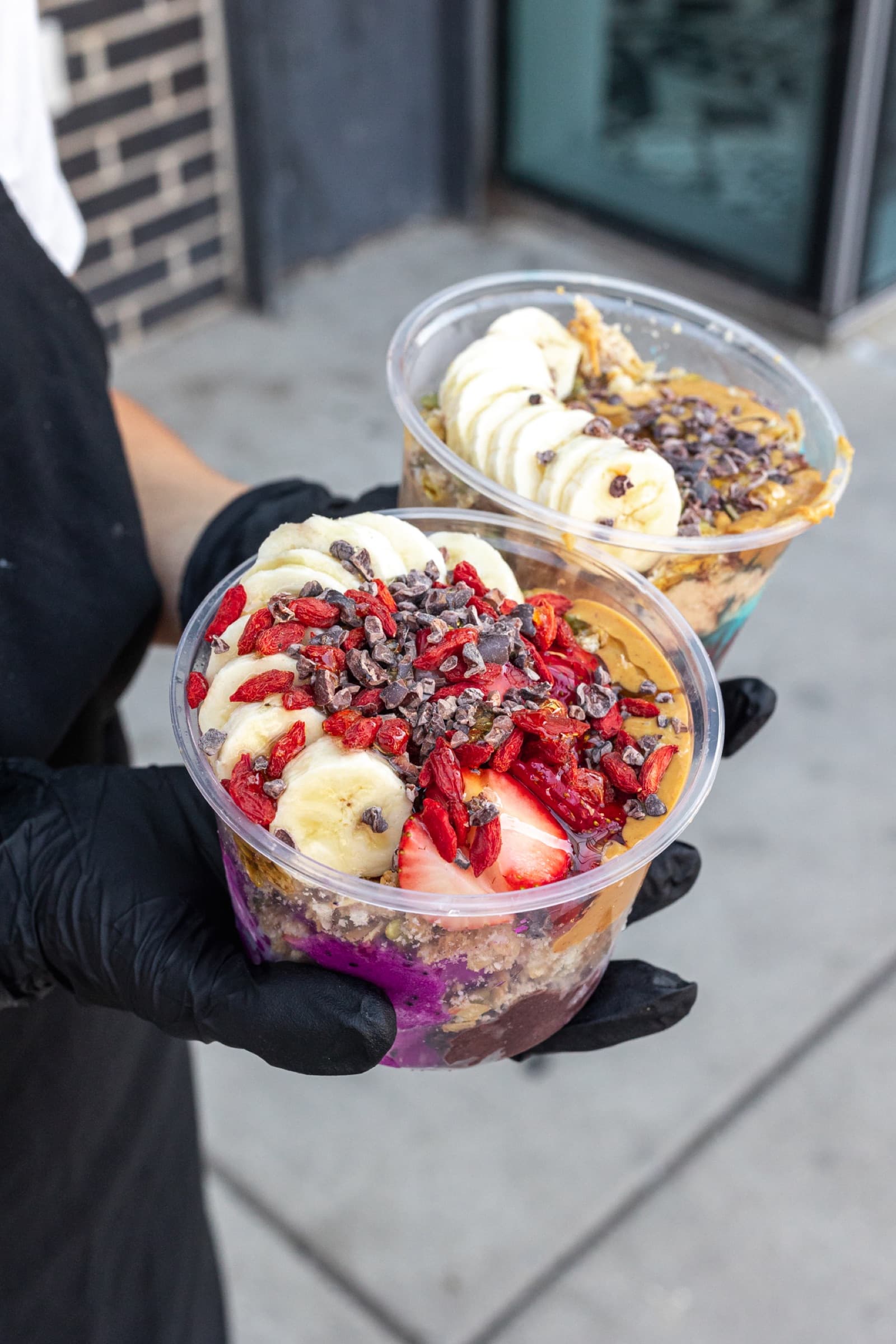 Handheld açaí bowls outside Comfort Fuel in Madison