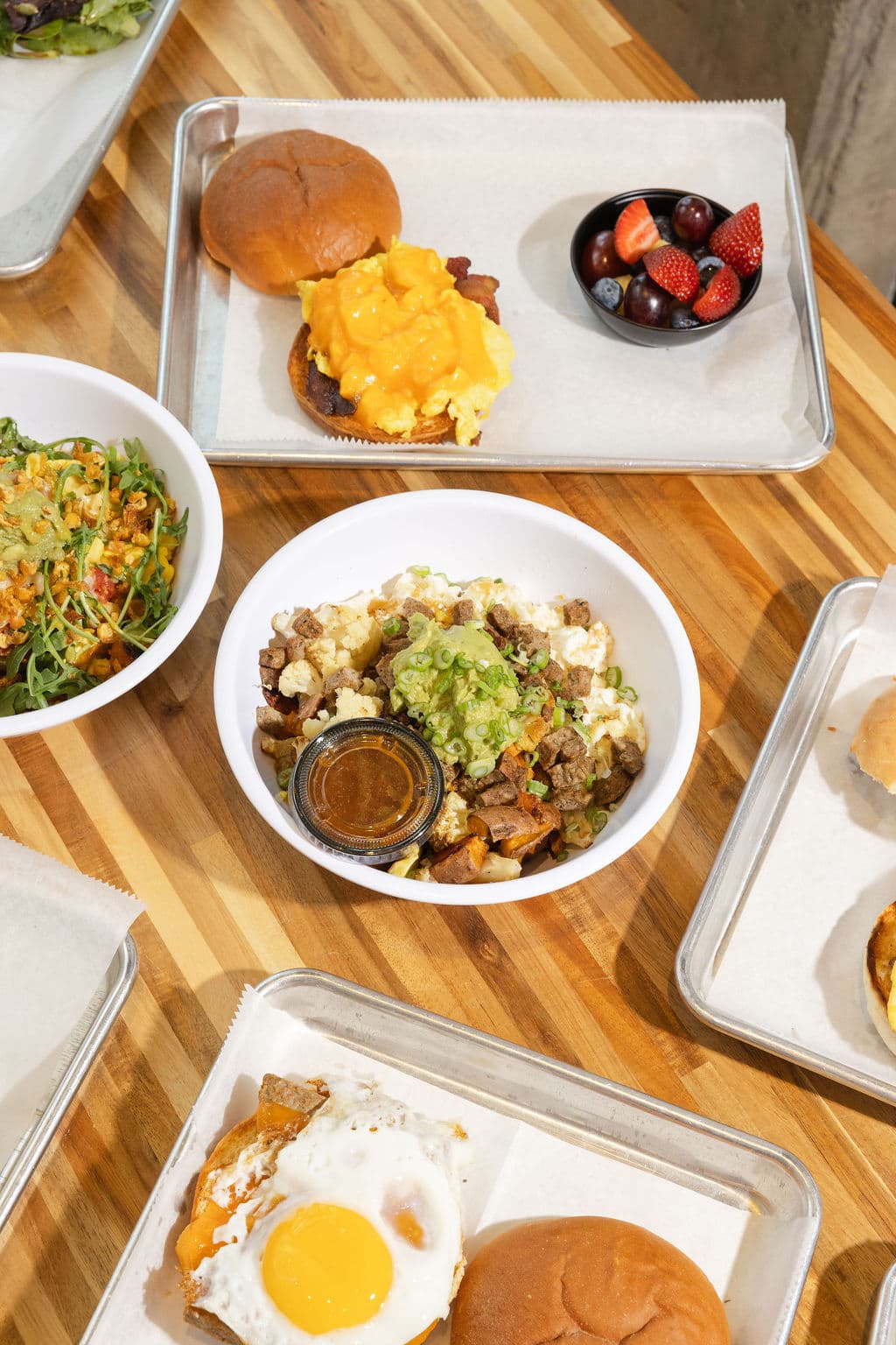 Comfort Fuel breakfast spread — bowls, sandwiches, and sides
