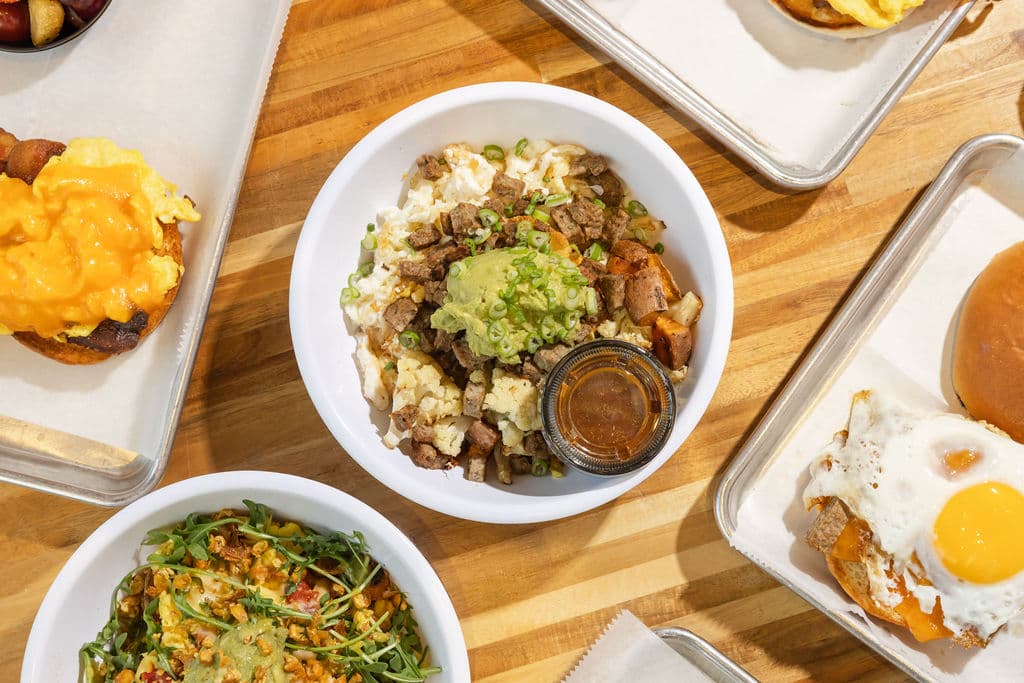 Breakfast catering setup — trays and fresh food